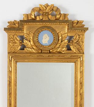 A Gustavian style mirror, circa 1900.