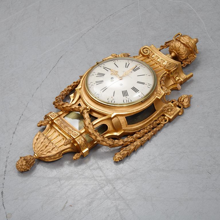 A gustavian style wall clock, signed Rob. Engström, Stockholm. First half of the 20th century.