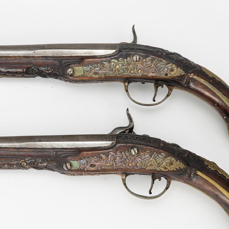 A pair of percussion pistols, converted from flintlock. 18th century.