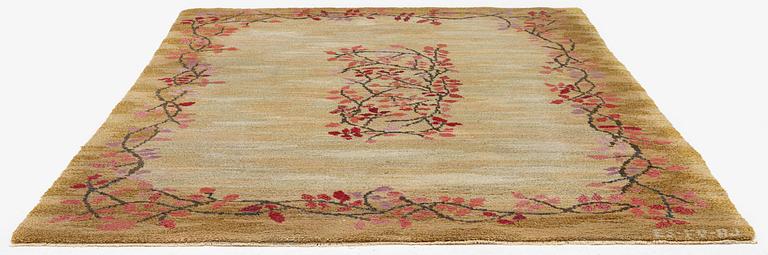 A knotted pile carpet, c. 275 x 177 cm, signed ES-FV-AJ.