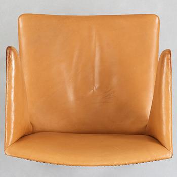 Frits Henningsen, a stained mahogany and brown leather armchair, Denmark.