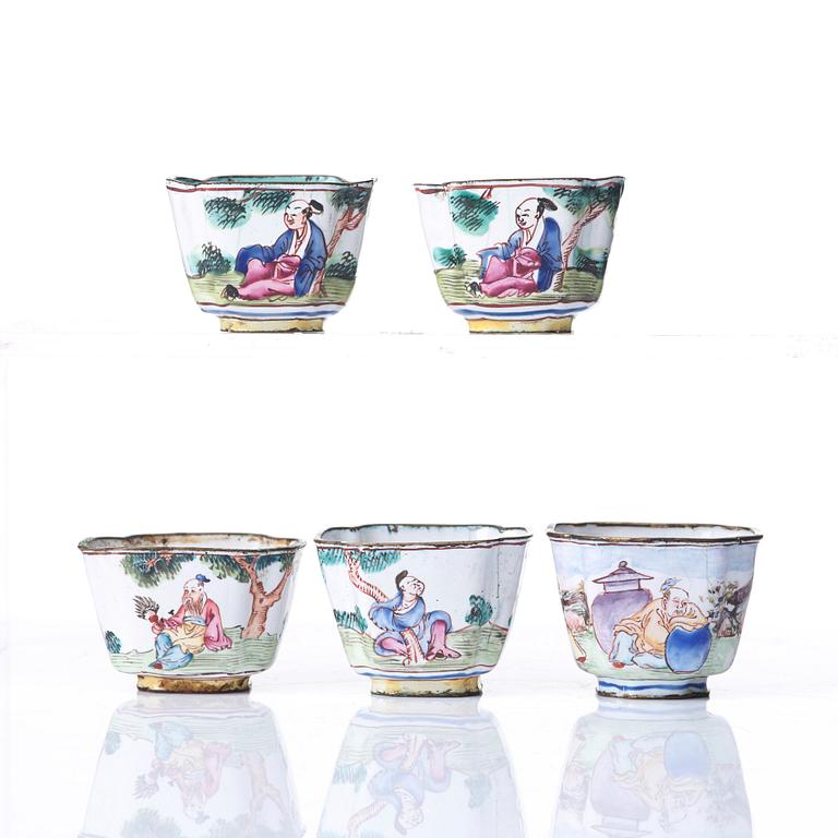 A set of five enamel on copper tea cups and a dish, Qing dynasty, circa 1800.