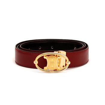 779. CÉLINE, a wine-red leather belt.