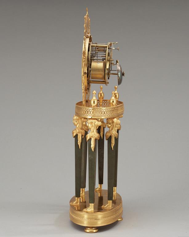 A French Empire gilt bronze mantel clock by L Grognot.