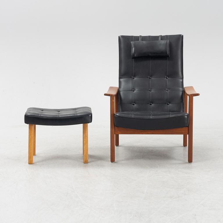 A 1970's teak and pvc coated fabric armchair and stool.