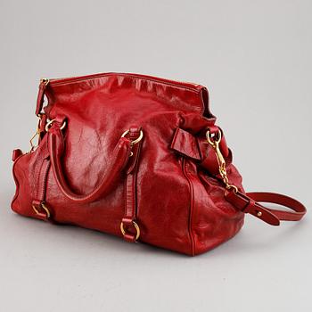 Miu Miu, a leather bag.