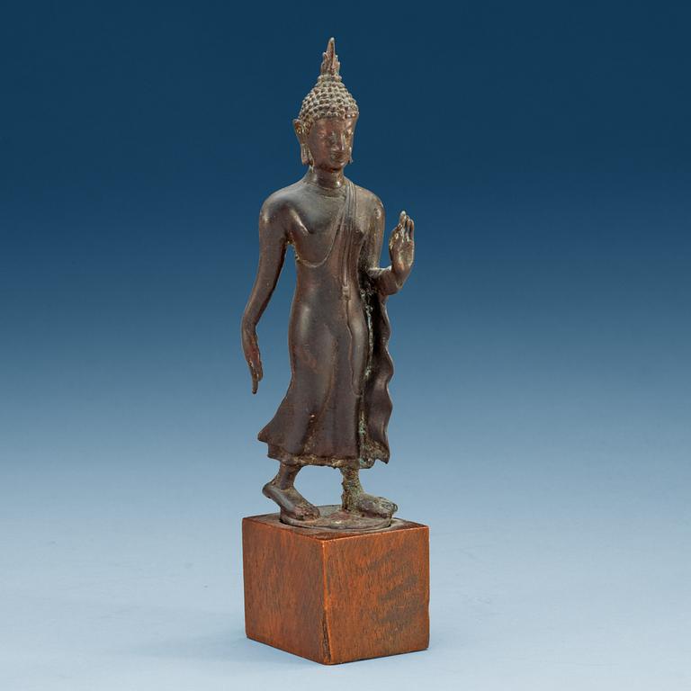 A walking Thai bronze figure of buddha, 19th Century or older.