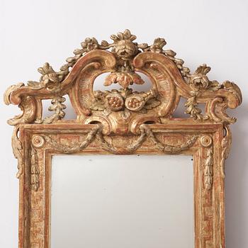 A Gustavian carved giltwood mirror, 1770's.