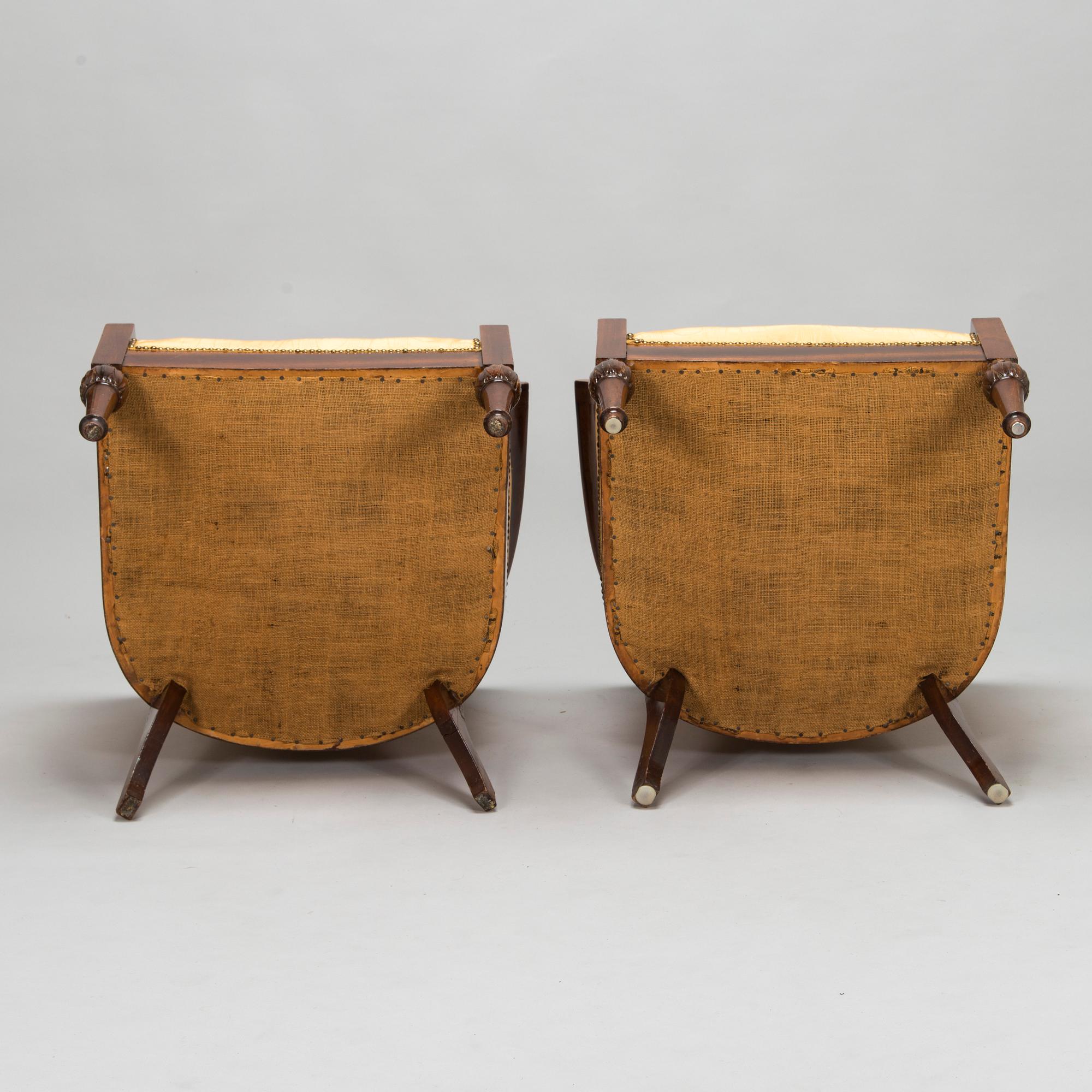 Pair of mahogany and mahogany veneered armchairs, 1920-30s.