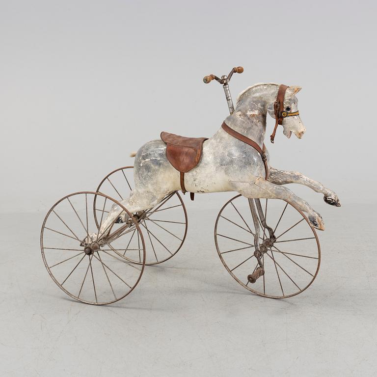 A wooden toy horse from the late 19th century.