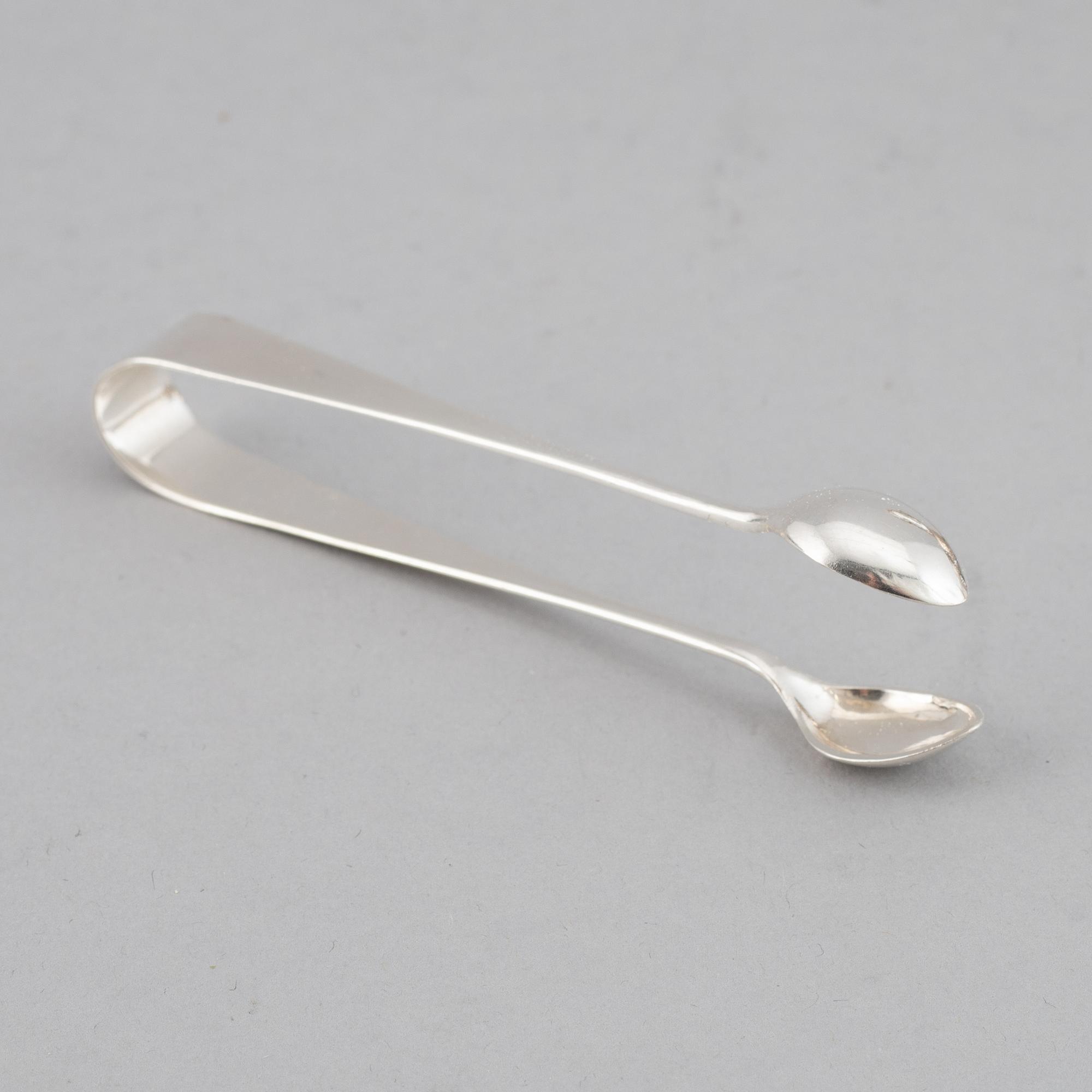 A swedish silver coffee pot, creamer and sugar box, J.E. Torsk, Stockholm 1900.