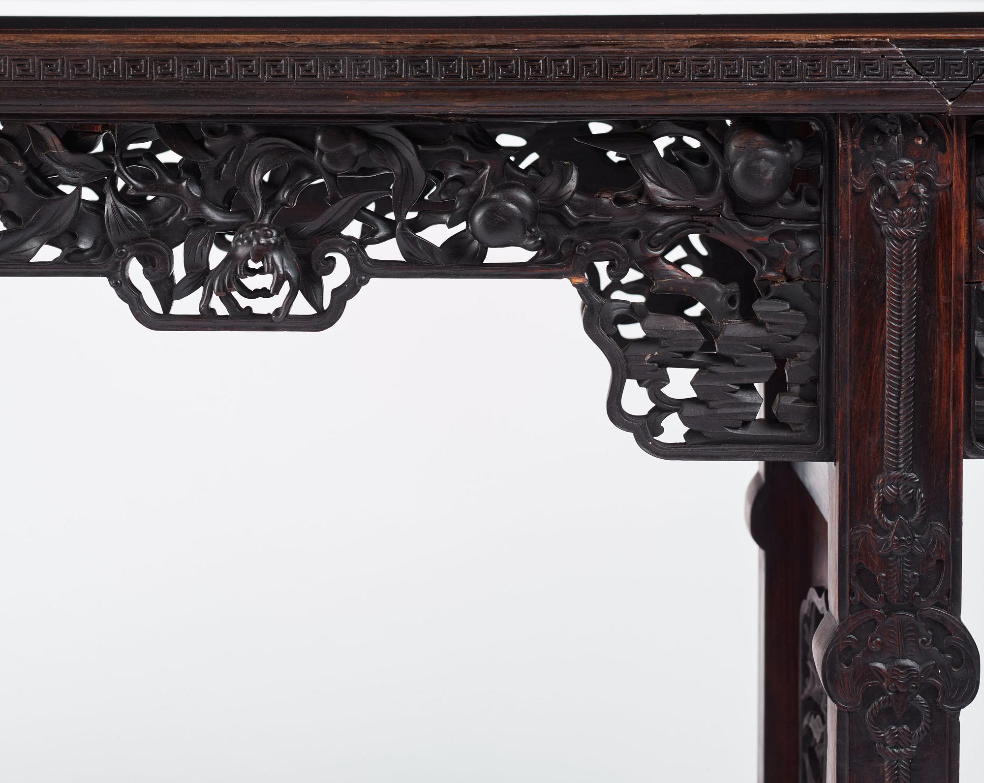 A massive zitan recessed-leg long table 'Jiaotousun Qiotouan', Qing dynasty, 19th century.