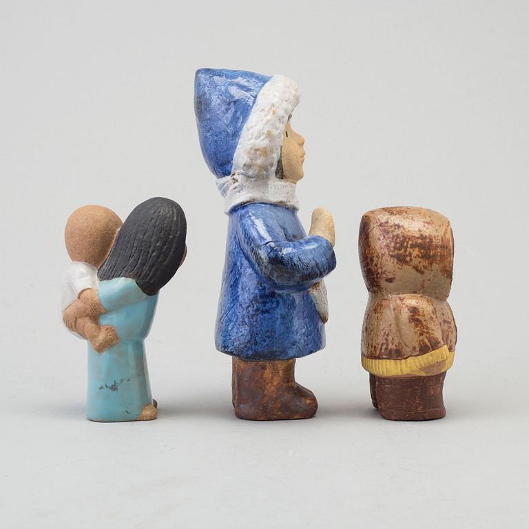 LISA LARSON, a set of three stoneware figurines, "North" and "East", 1974 and "Four years", 1977, Gustavsberg, Sweden.