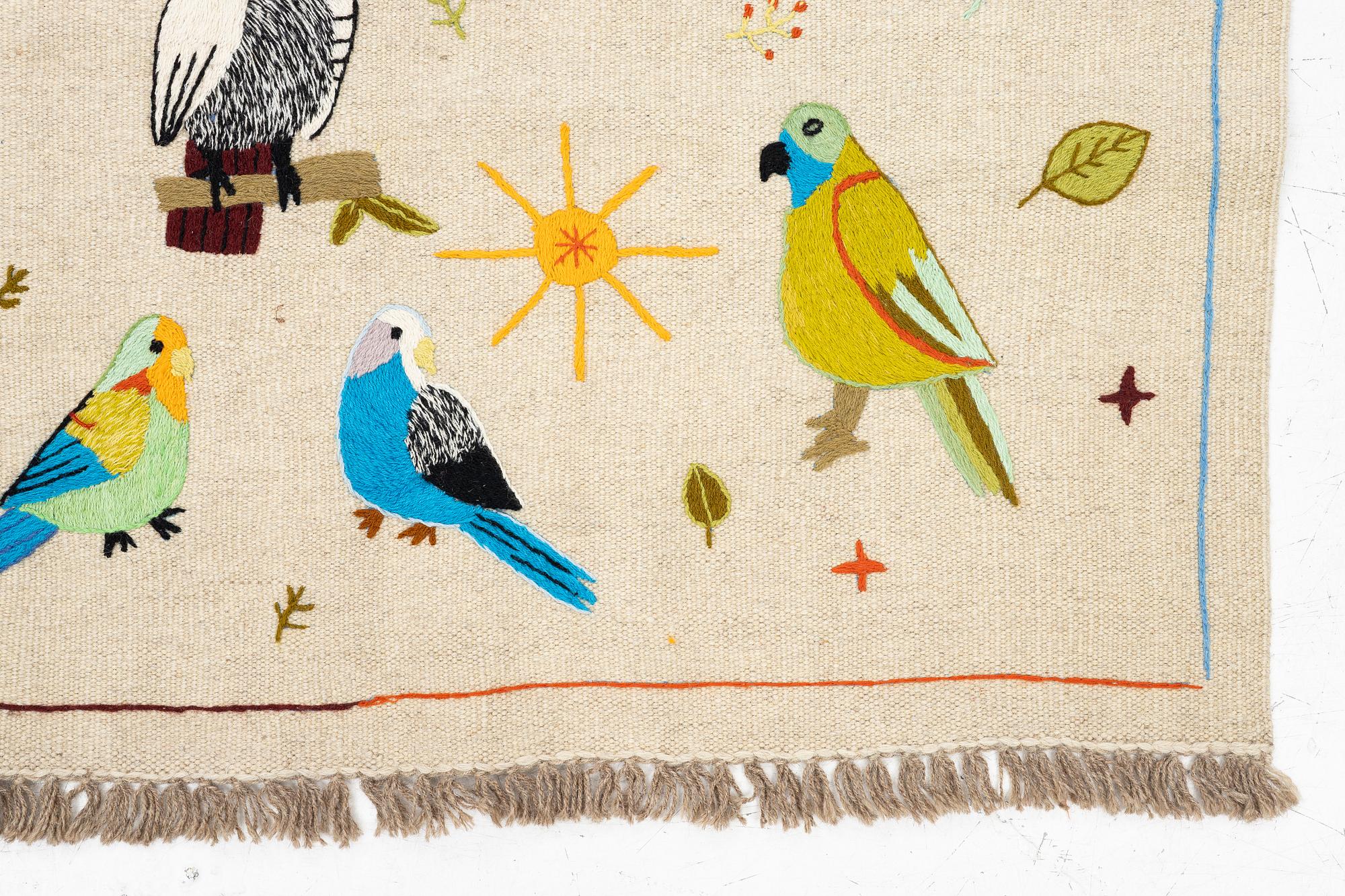 A hand-embroidered Kelim rug, 180 x 118 cm.