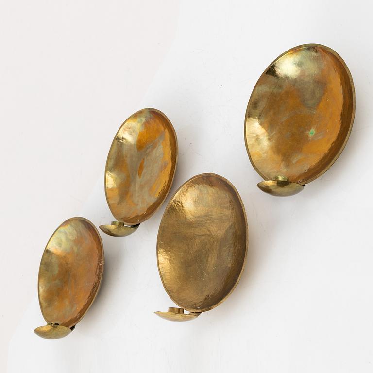 Karl-Erik Torssell, a set of four brass 'Kungalampetten' one-light reflector plates.