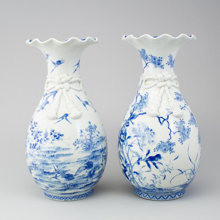 A matched pair of blue and white vases, Japan, early 20th Century.