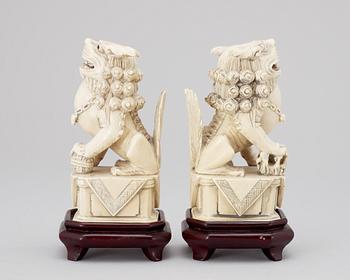 A pair of 20th century ivory figures, China.