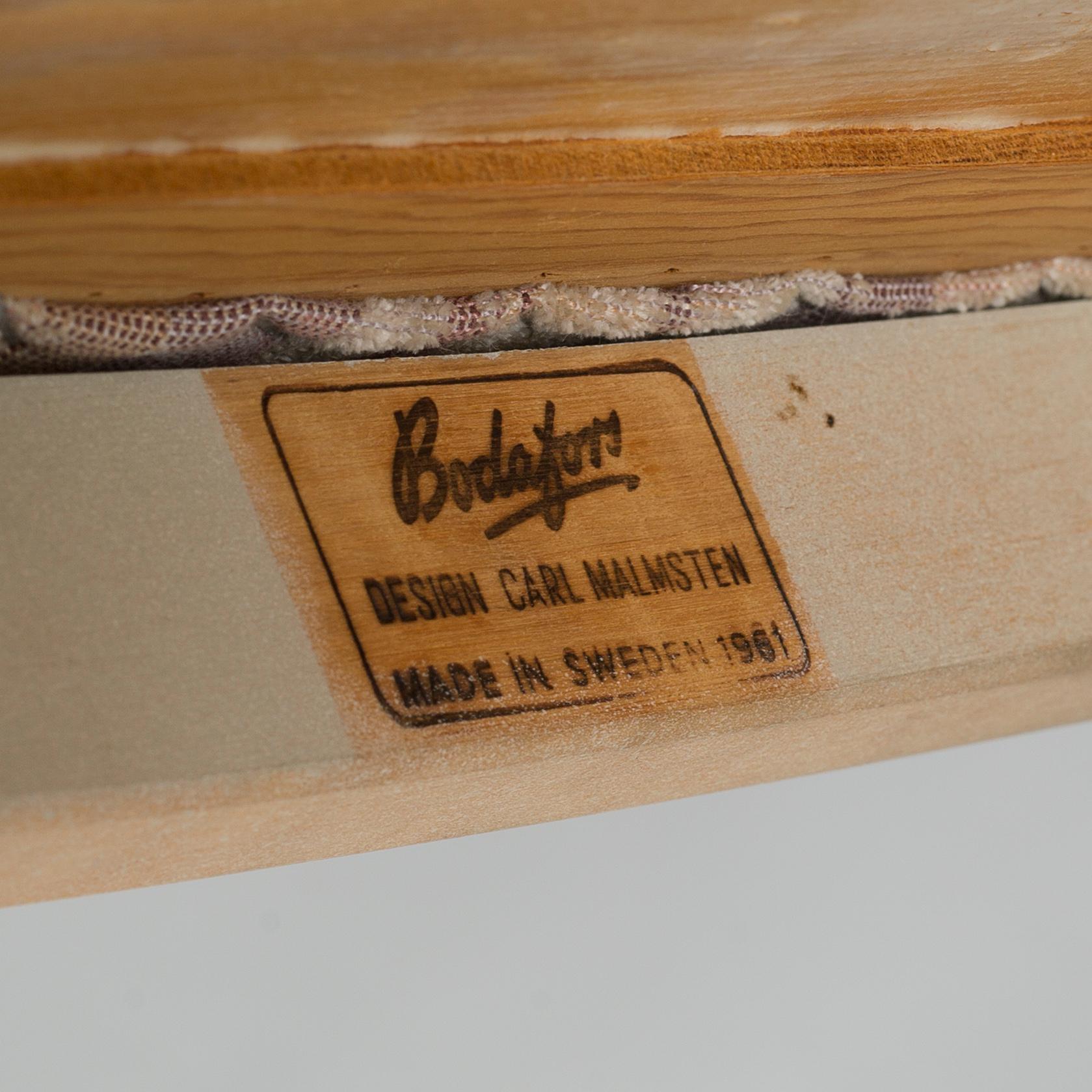 A dining table and six chairs, chairs by Carl Malmsten, model "Herrgården", second half of the 20th century.