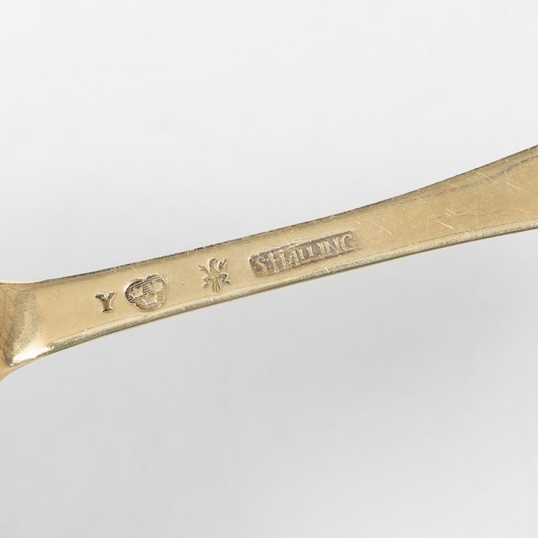 A Swedish silver gilt spoon, and a silver serving spoon, 18-19th Century.
