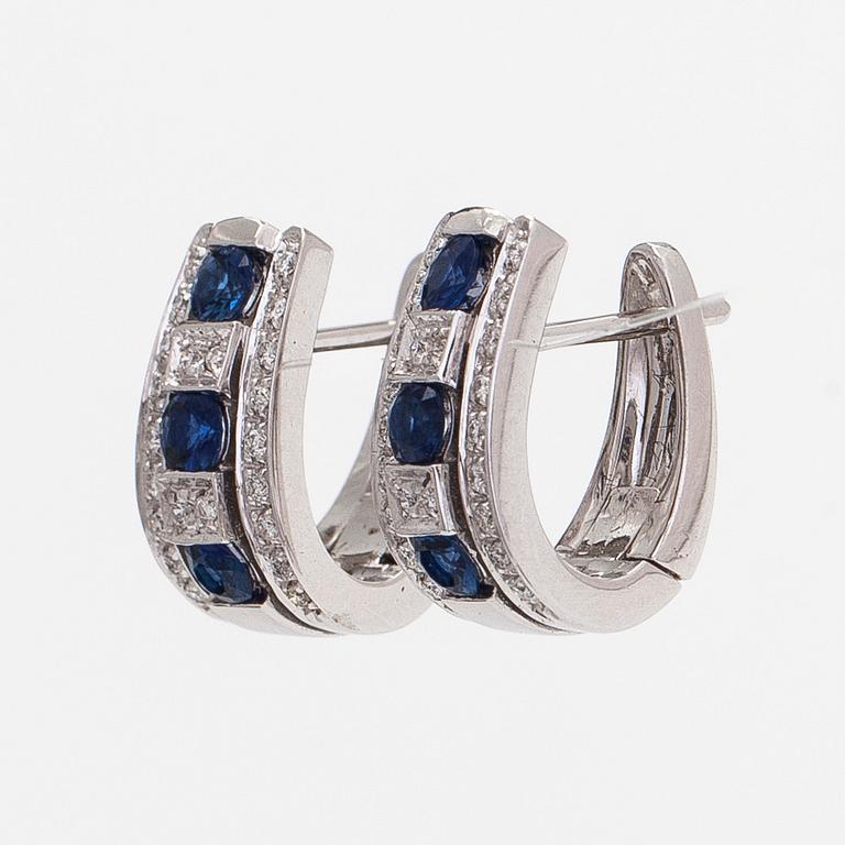 Earrings 18K white gold with faceted sapphires and round brilliant-cut diamonds.
