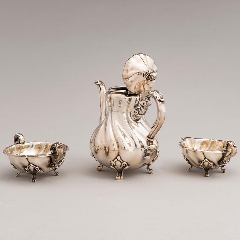 A silver sugar tong and a 3-piece silver coffee set, mark of Juho H. Pekuri, Oulu 1931 and Finnish import marks 1938.