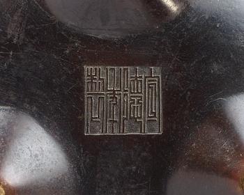 A bronze tripod censer, Qing dynasty.