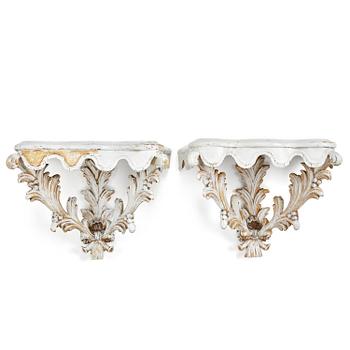 23. A pair of French Louis XVI-style consoles, late 19th century.