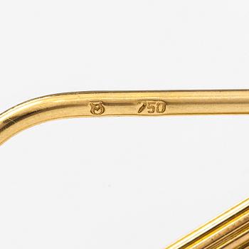 A keychain made of 18K gold with a 900 gold Helvetia 20 franc coin.
