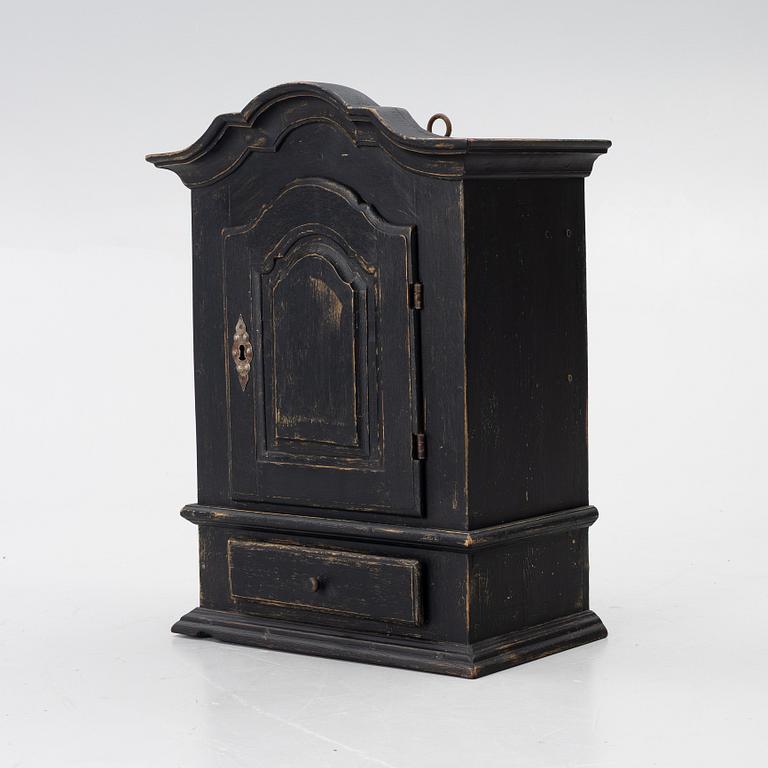 A Baroque wall cabinet, 18th Century.