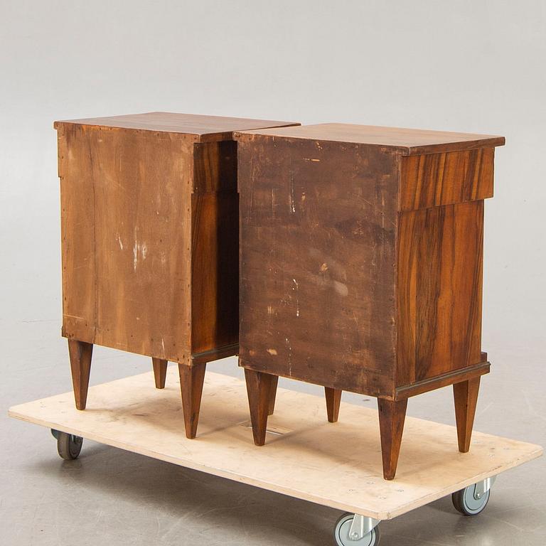 A pair of walnut Empire style bedside tables first half of the 20th century.
