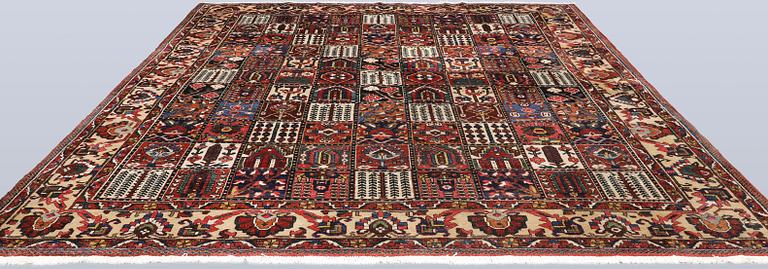 A semi-antique Baktiari carpet, approx. 360 x 308 cm.