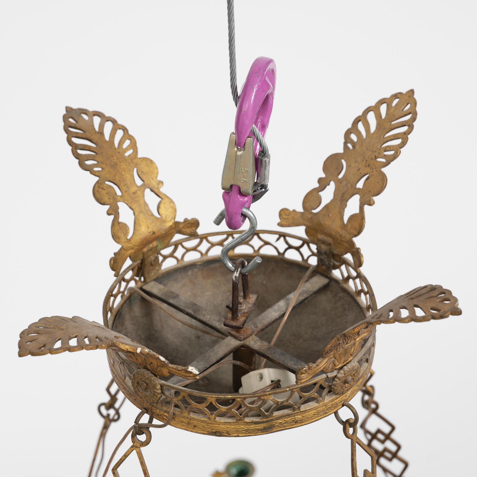 A presumably Russian Empire gilt and patinated bronze nine-branch chandelier, 19th century.