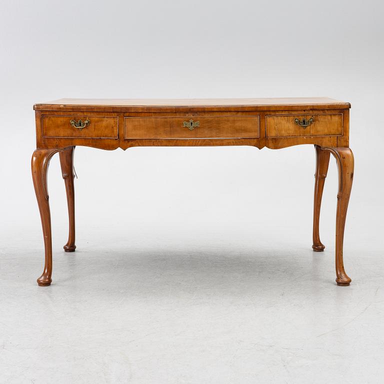 A George II walnut partner's desk, mid 18th century.