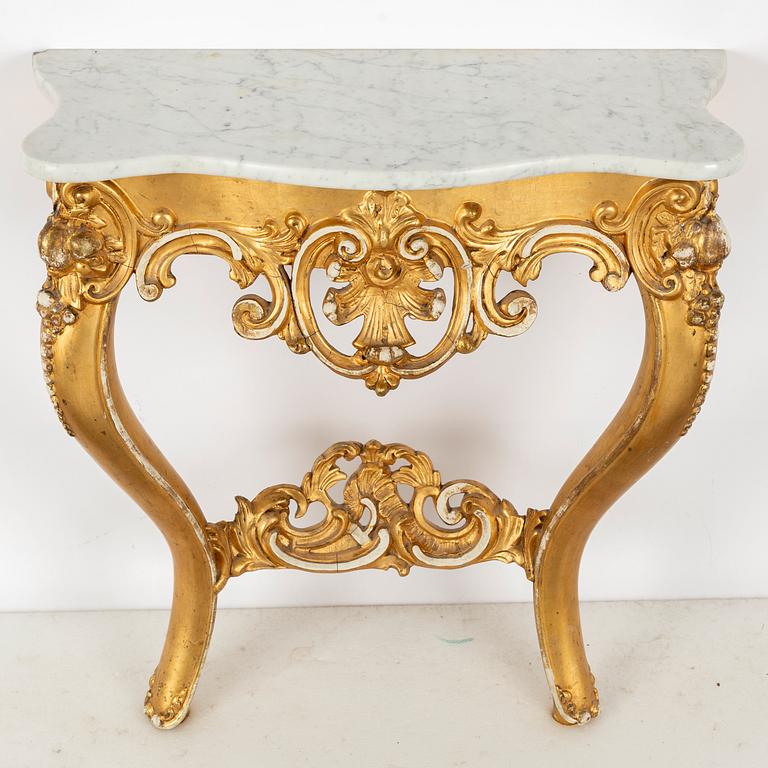 A Rococo revival mirror and a console table, second half of the 20th Century.