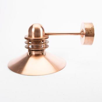 Louis Poulsen,a copper Nyhavn wall lampfrom Louis Poulsen.