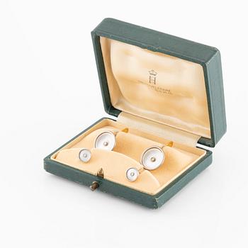 C.G Hallberg, cufflinks and shirt studs, two pairs, 18K gold with diamonds and mother-of-pearl.