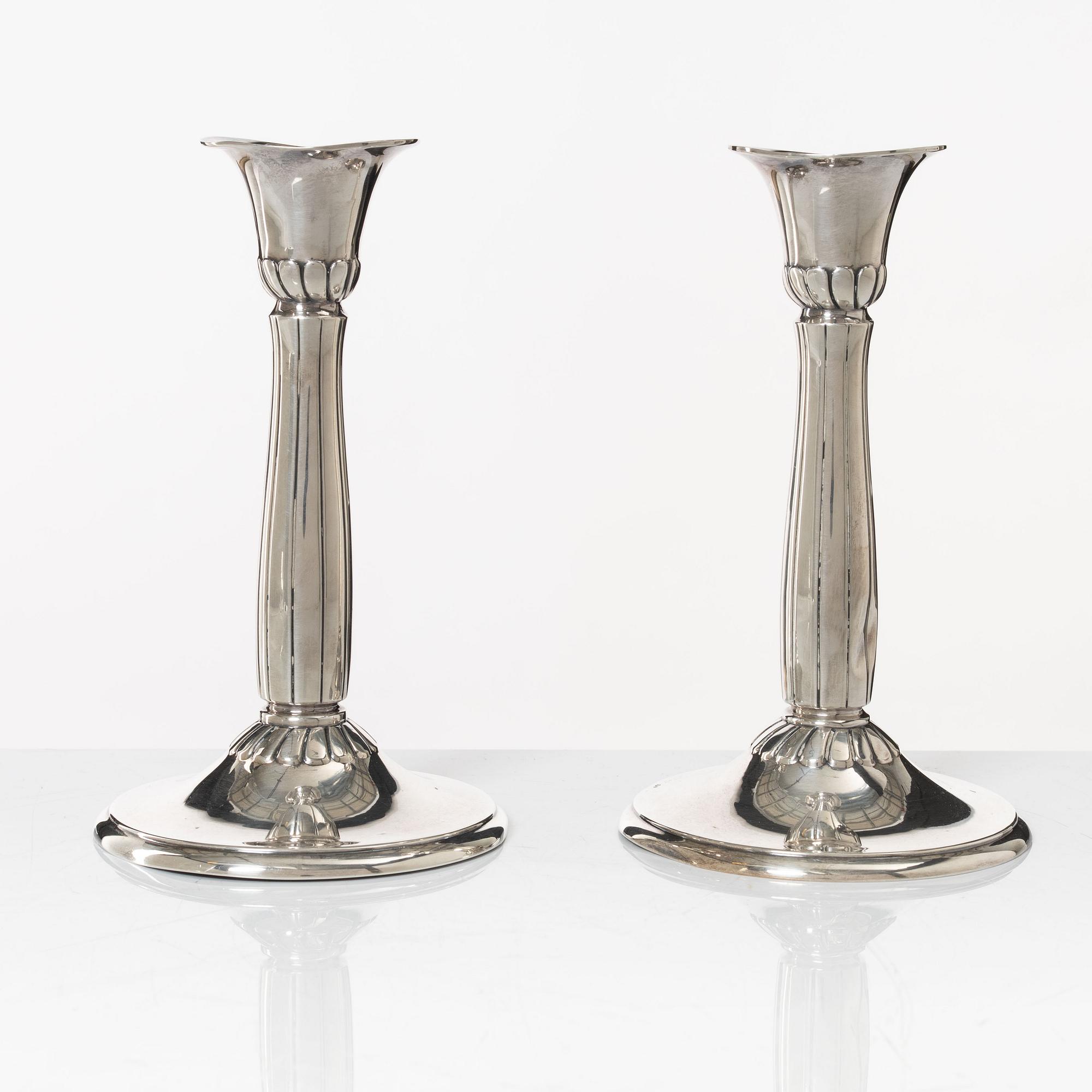 A pair of silver candle sticks, first half of the 20th century.