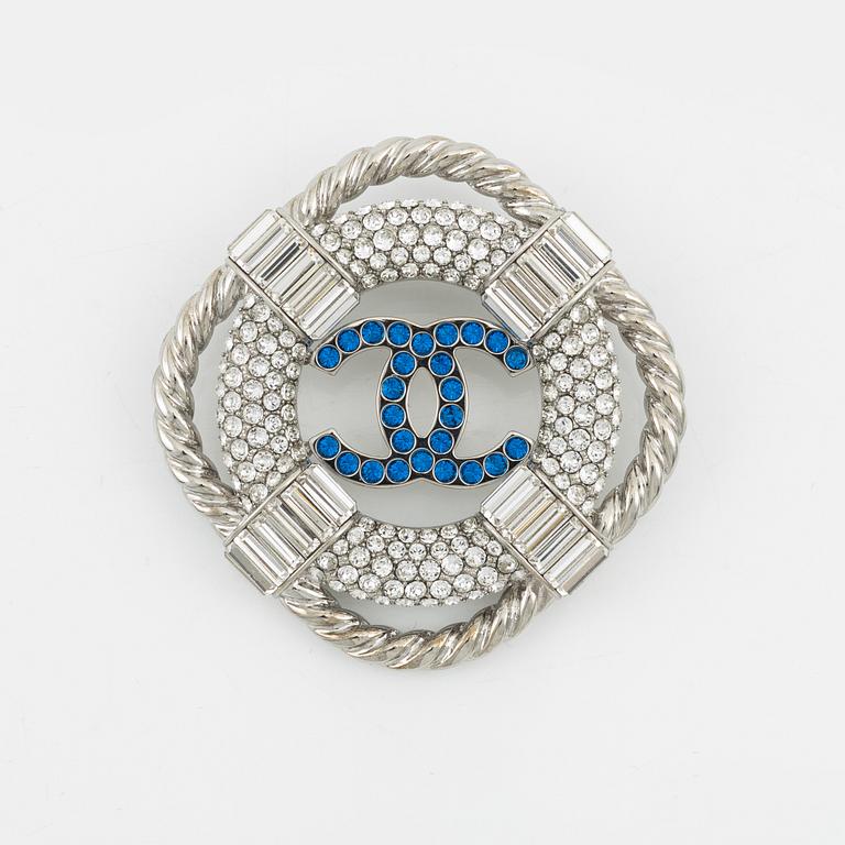 Chanel, a silvermetal, rhinestone and crystal brooch, 2019.