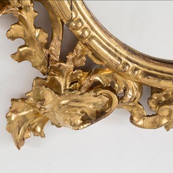 A 20th century Baroque style mirror.