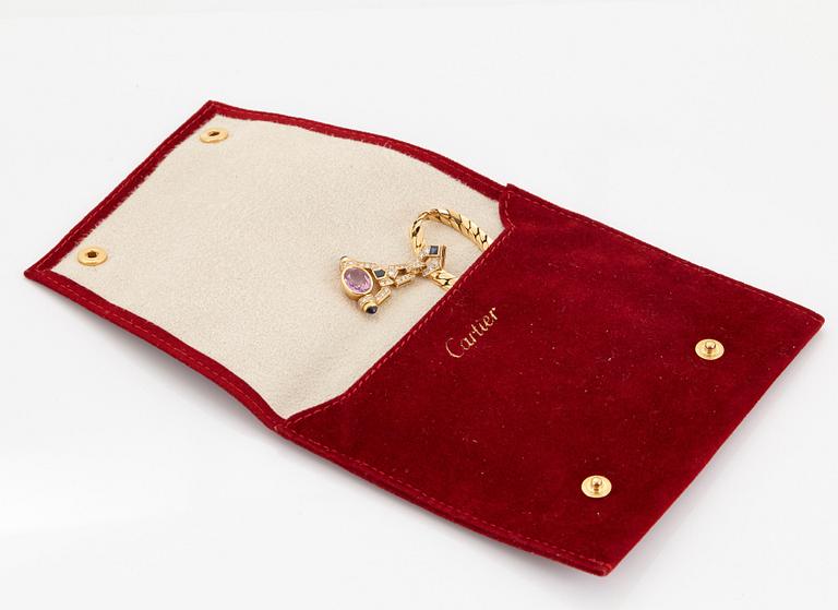 A Cartier necklace in 18K gold set with a pink sapphire and round brilliant-cut diamonds.