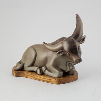 Gunnar Nylund, a stoneware sculpture of a reclining buffalo, Rörstrand, number 16/200.