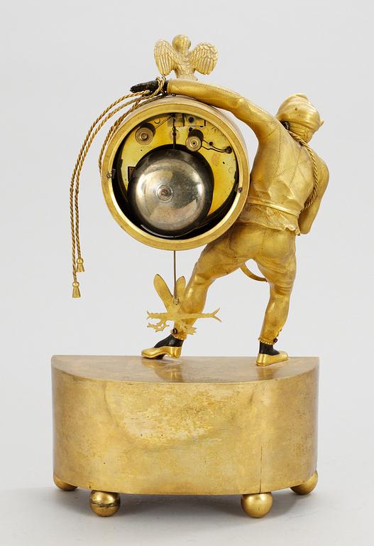An Empire gilt bronze mantel clock by J. Holmgren.