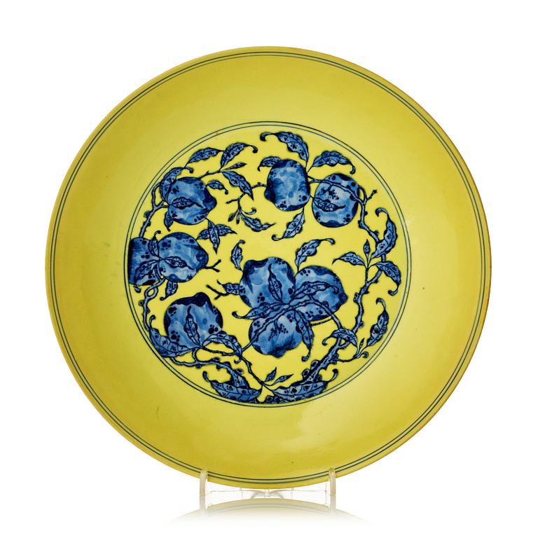 A large yellow ground underglaze blue peach dish, Qing dynasty, Qianlong six character mark (1736-1795).