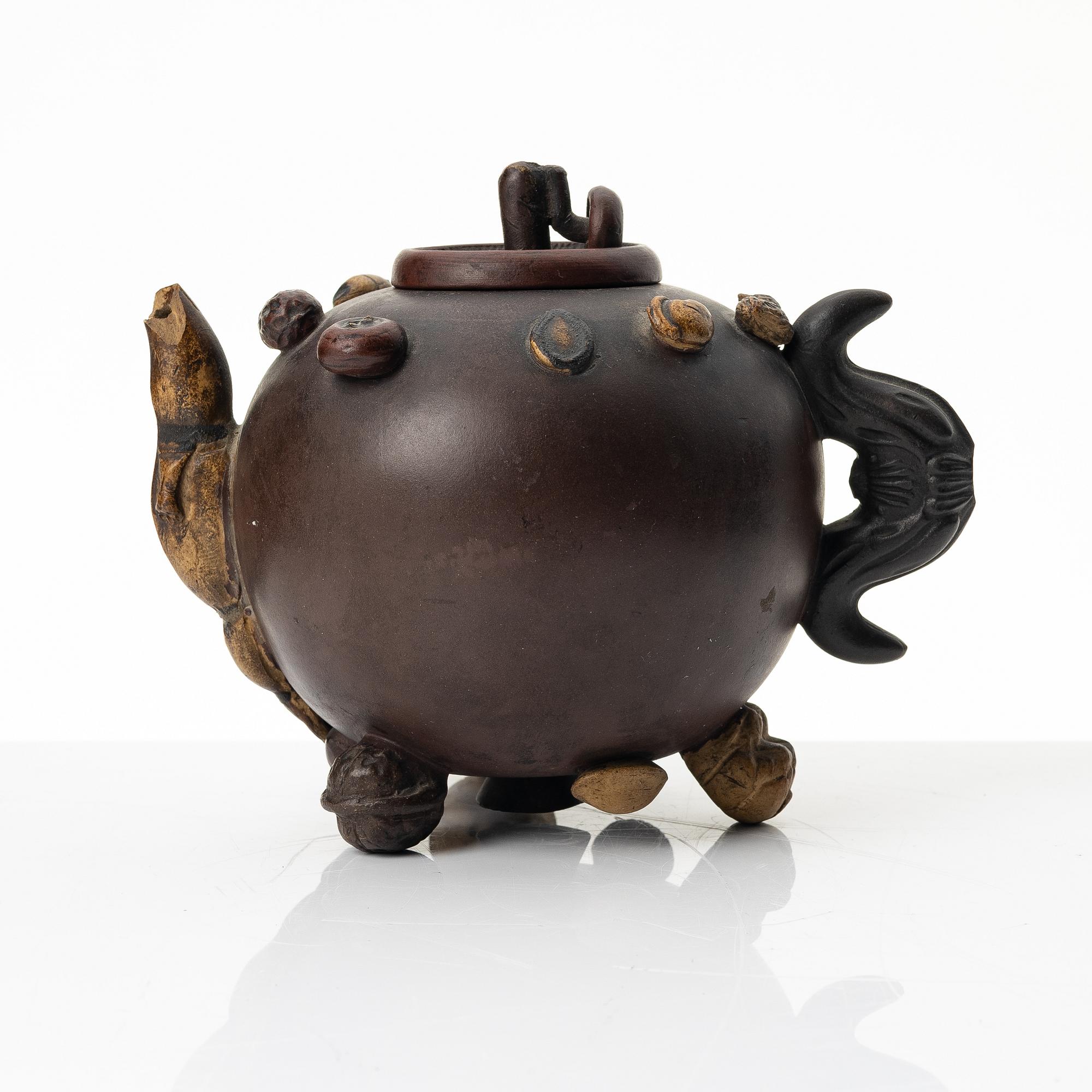 A Chinese 'hundred-fruit' yixing teapot, Qing dynasty (1644-1912).