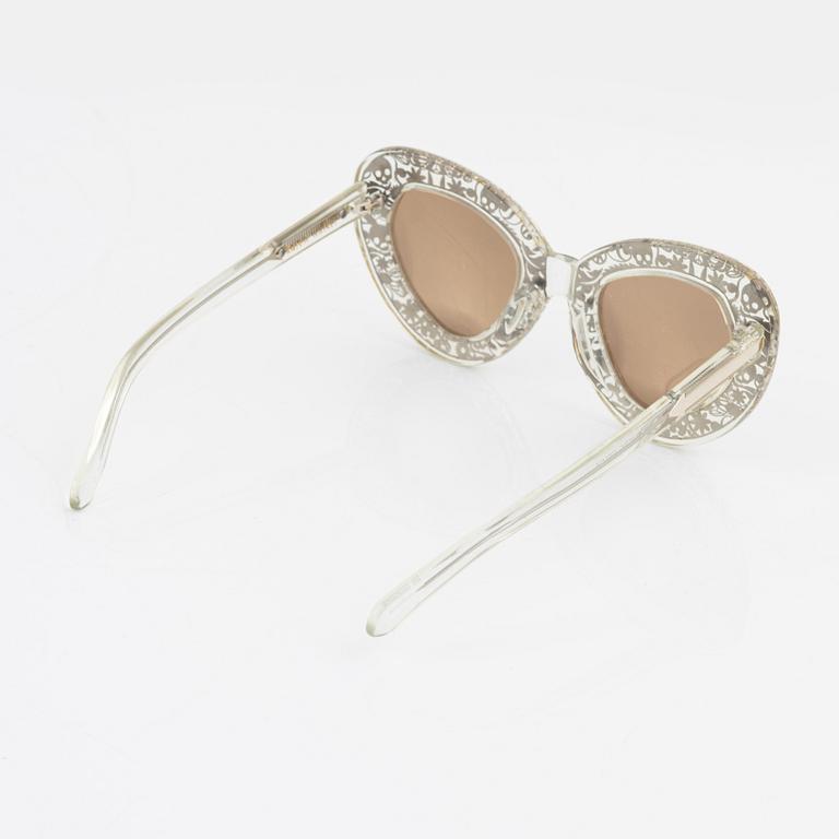 Karen Walker, a pair of "Intergalactic" sunglasses.