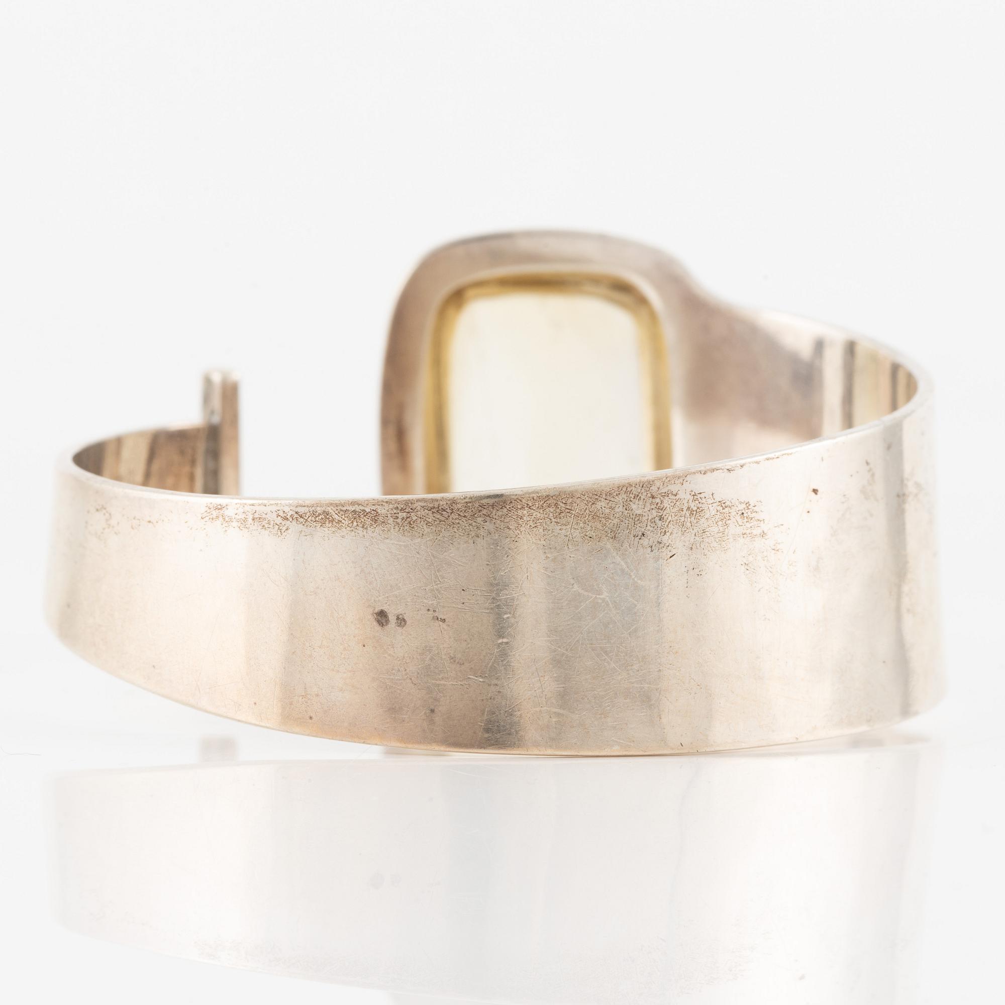 Bengt Liljedahl, arm ring, silver with light yellow stone.