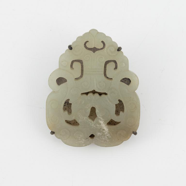 A nephrite and silver-plate clip, China, 20th century.