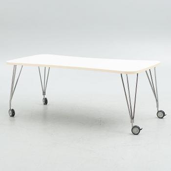 A contemporary table on wheels.