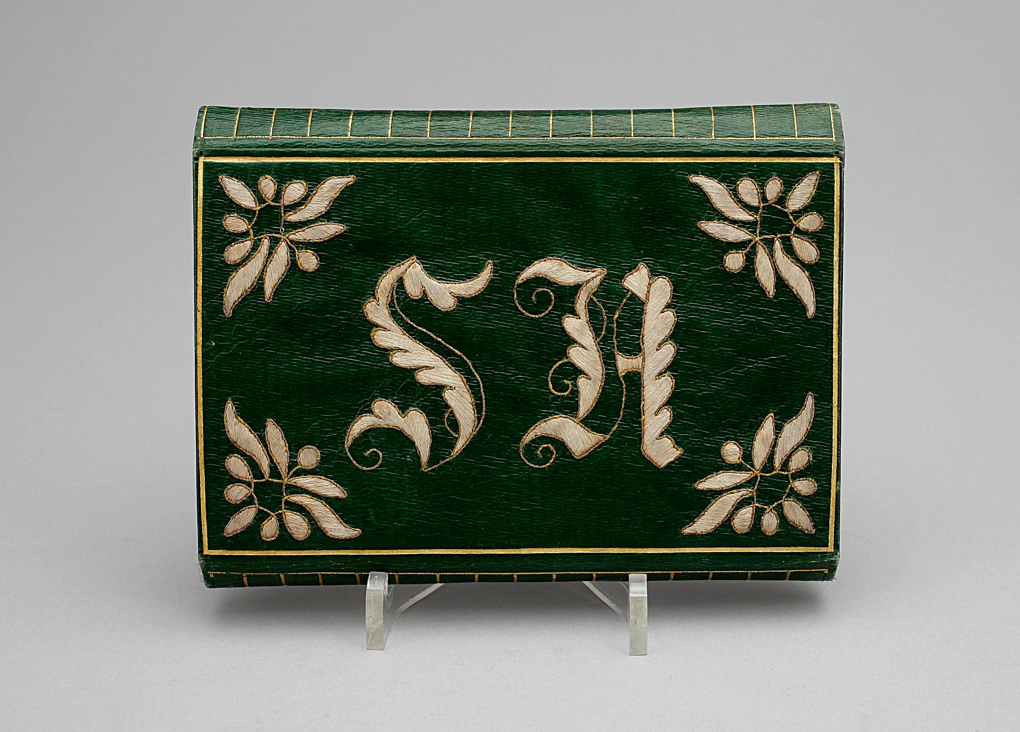 PLÅNBOK, bland annat textil och mässing,  1800-talets mitt.