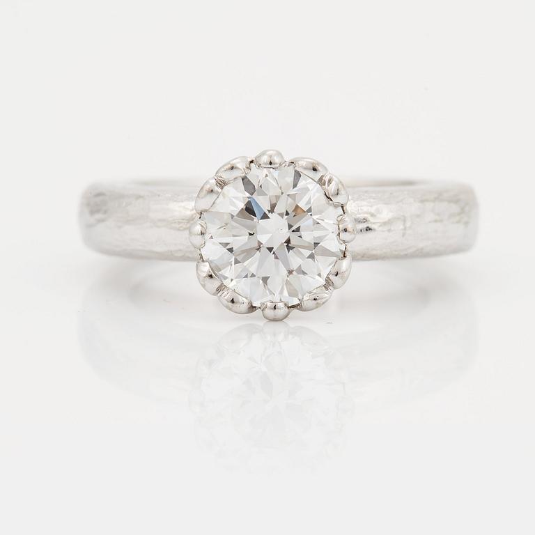 A SOLITAIRE RING.